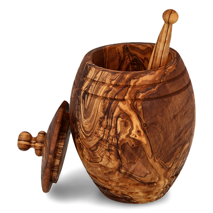 Olive wood honey jar with dipper and open lid against transparent background.