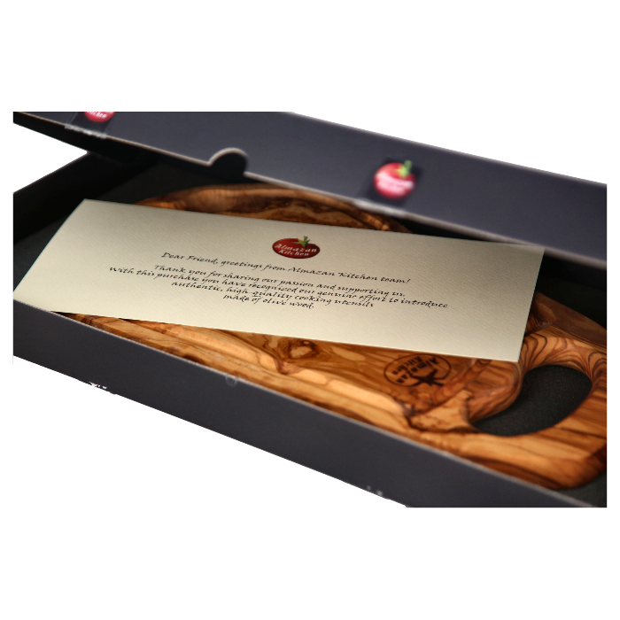Almazan Kitchen olive wood steak board in it's packaging with a special note from the owner.