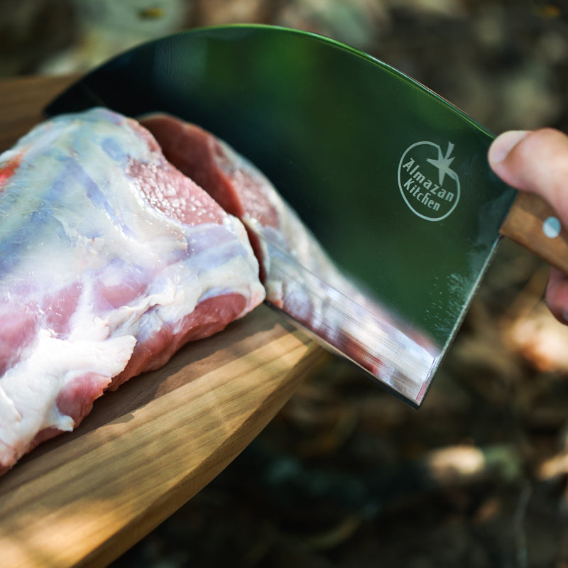Almazan Kitchen Steak knife shown cutting meat