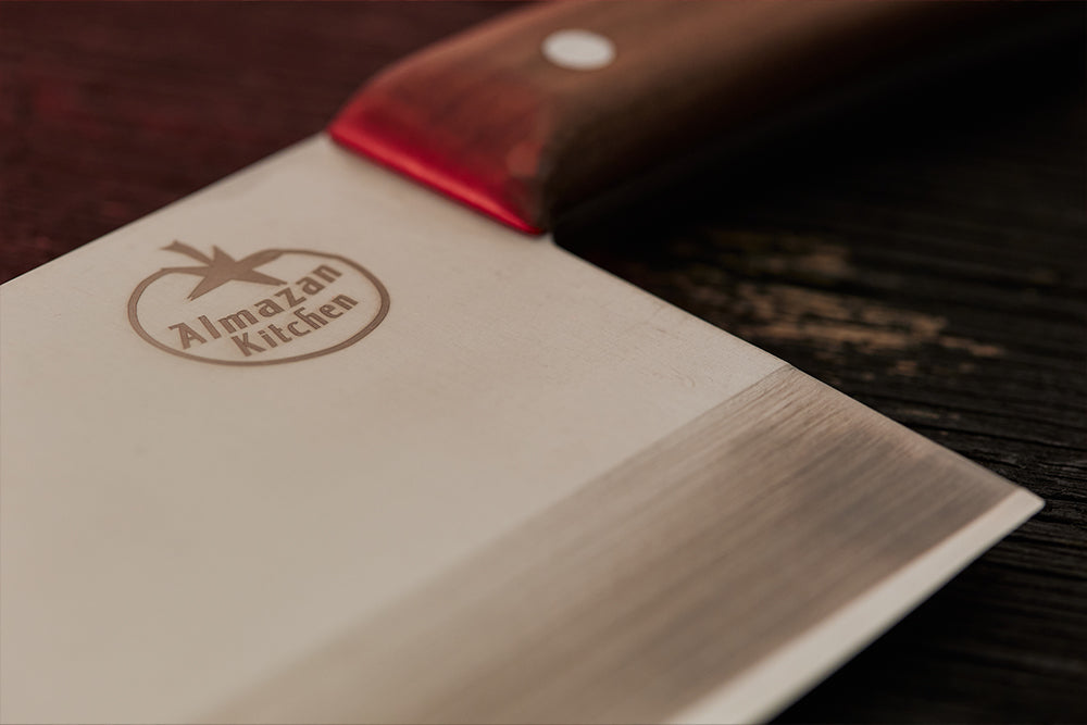 Close up of the Almazan Kitchen logo on the blade of the Promaja Knife.