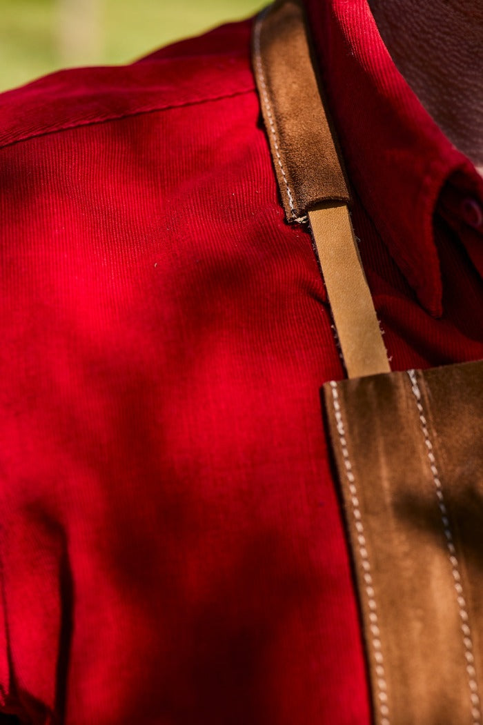 Close up of the stitching on a leather apron.